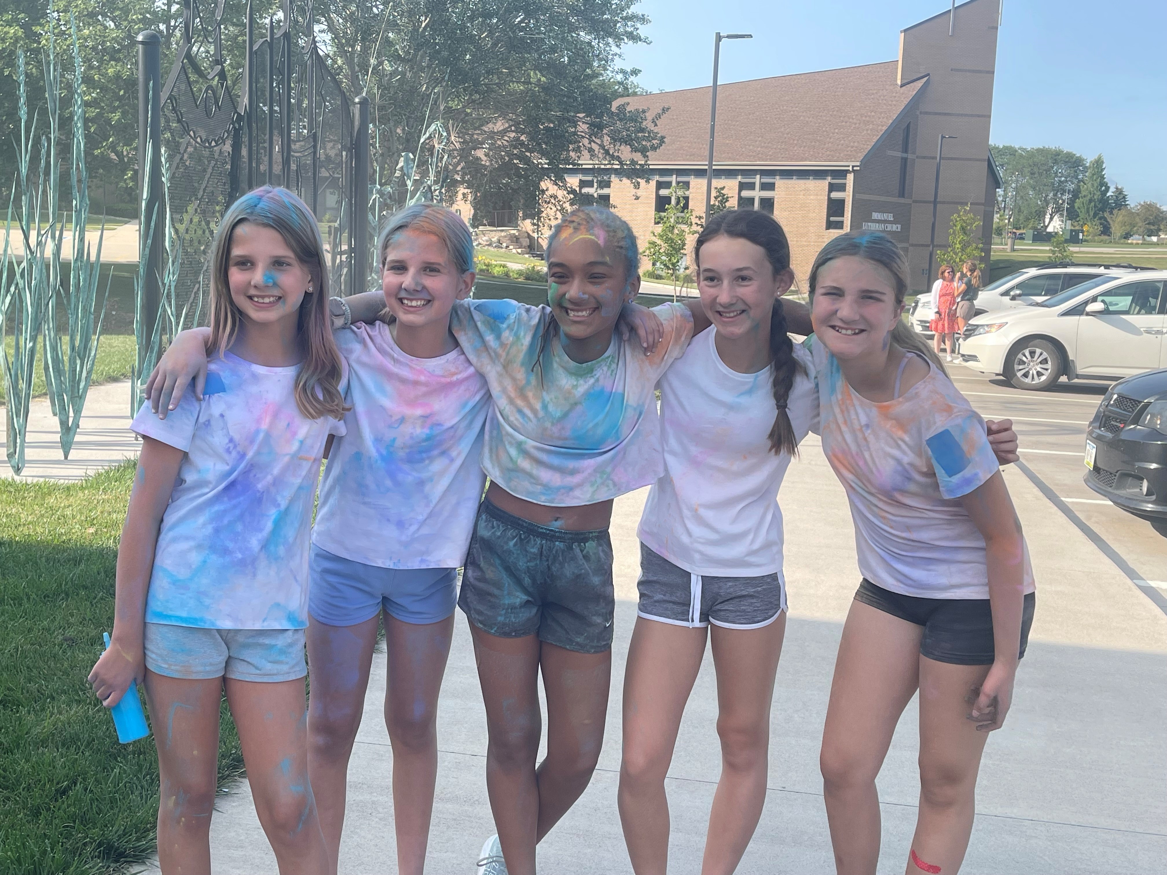 Image of teens with colored powder.