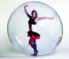 Image of performer in a hamster ball.